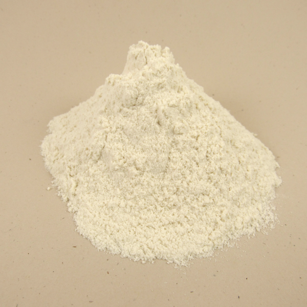 Off white powder on a tan background