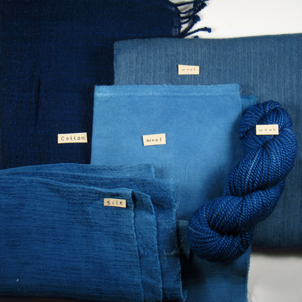 blue fabrics and yarn in different shades