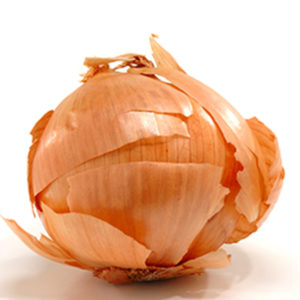 Image of whole yellow onion with flaking onion skin