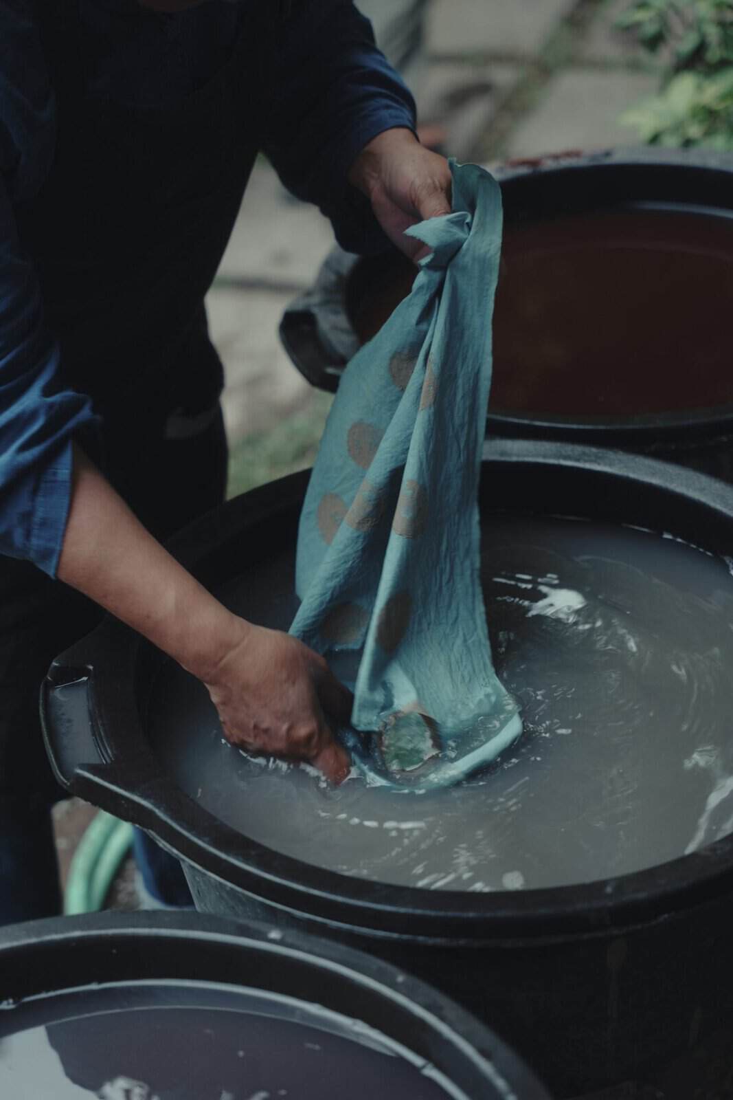 Dipping cloth into the dye bath